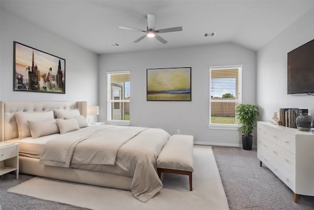 bedroom featuring ceiling fan, lofted ceiling, and light colored carpet