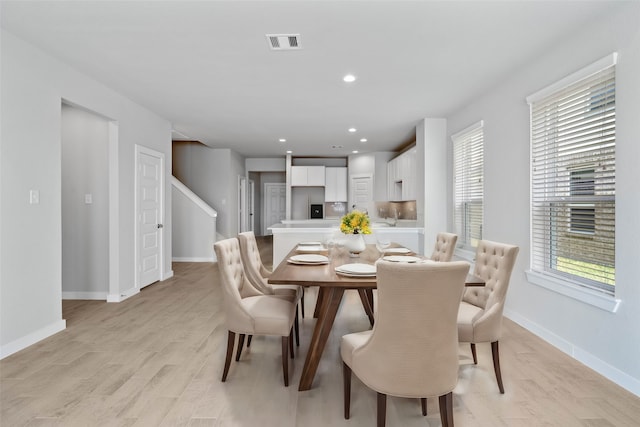 dining area with light hardwood / wood-style flooring