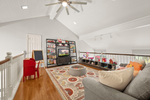 living room featuring vaulted ceiling with beams, hardwood / wood-style flooring, and ceiling fan