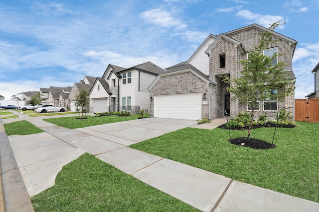 view of front of property featuring a front lawn and a garage