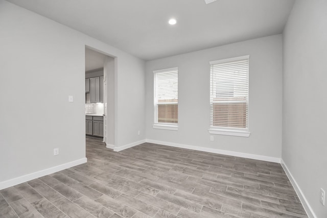 empty room with light hardwood / wood-style floors