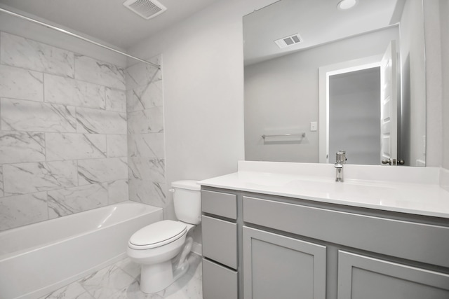 full bathroom with vanity, tiled shower / bath, and toilet