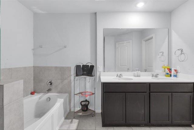 bathroom featuring vanity, tile patterned flooring, and a bathing tub