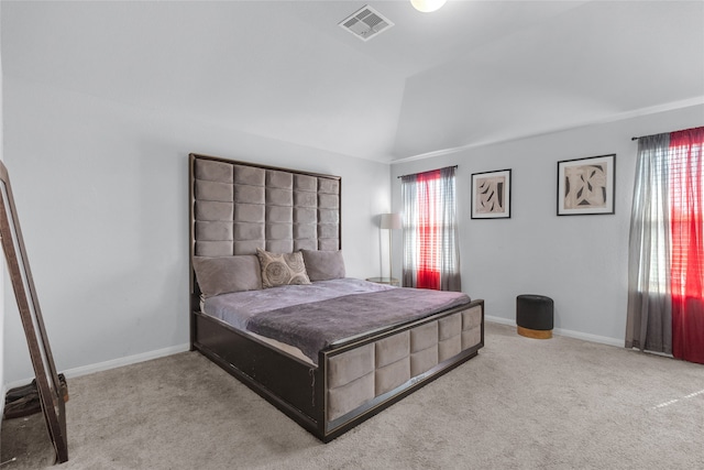 bedroom featuring carpet flooring and vaulted ceiling