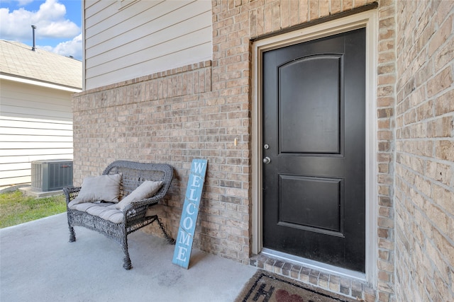 entrance to property featuring central AC unit