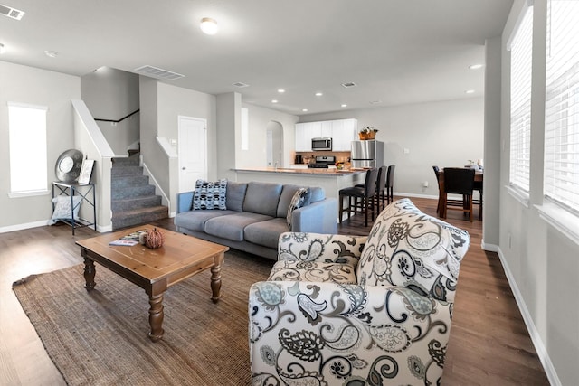 living room with dark hardwood / wood-style floors