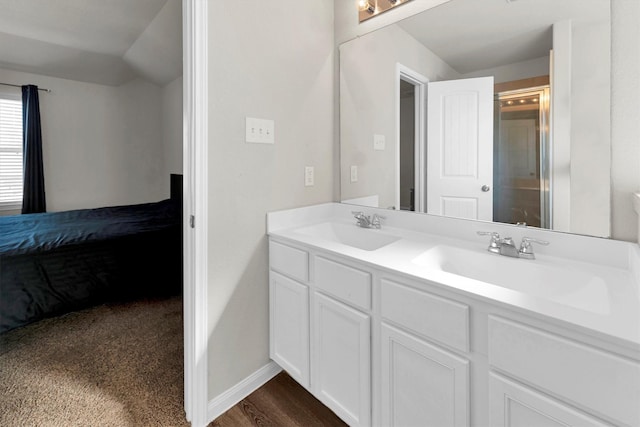 bathroom with an enclosed shower and vanity