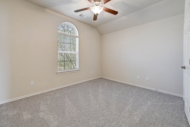 unfurnished room with vaulted ceiling, carpet floors, and ceiling fan