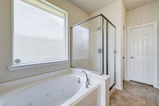 bathroom with tile patterned floors and plus walk in shower