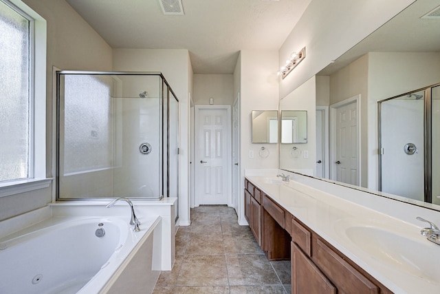 bathroom with vanity, independent shower and bath, and tile patterned floors