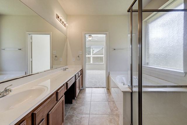 bathroom with a wealth of natural light, vanity, shower with separate bathtub, and tile patterned floors