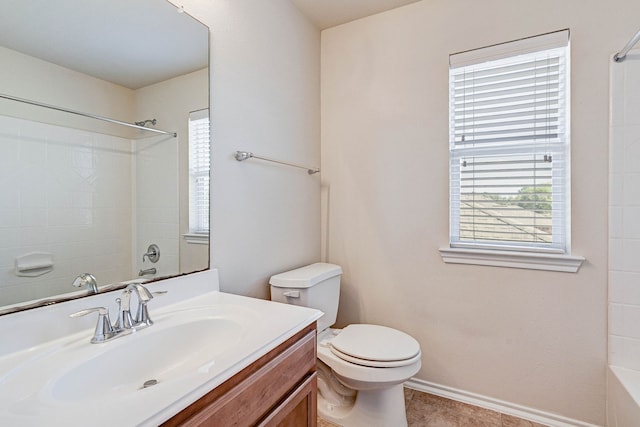 full bathroom featuring vanity, bathing tub / shower combination, toilet, and tile patterned floors