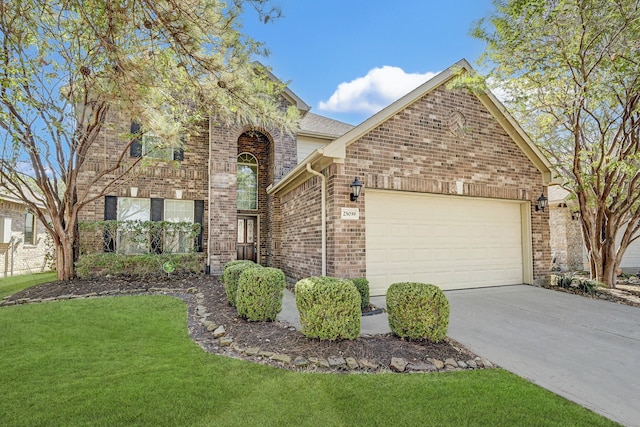 view of front of house featuring a garage and a front lawn