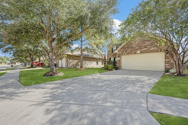 view of front of house featuring a garage and a front lawn