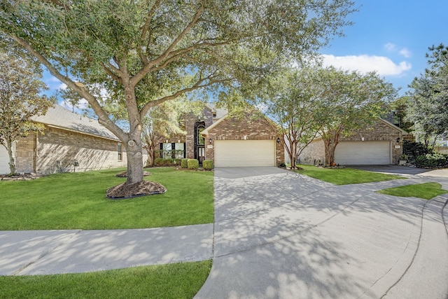 view of front facade with a front yard and a garage