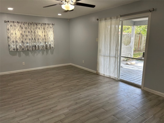 empty room featuring wood-type flooring and ceiling fan