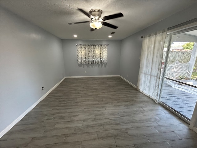 spare room featuring ceiling fan, a textured ceiling, and hardwood / wood-style flooring