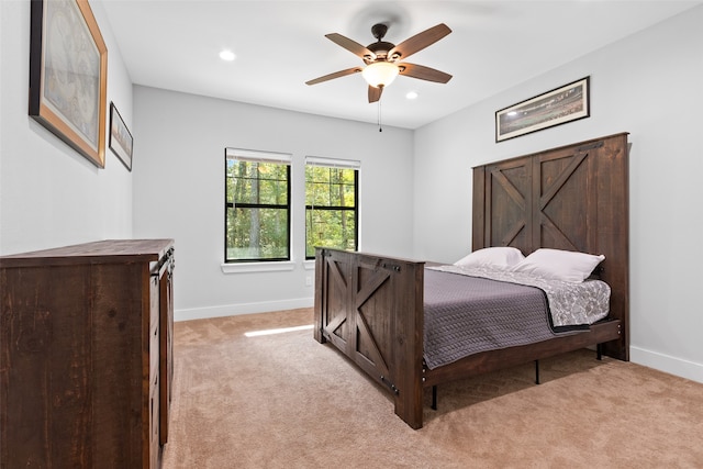 carpeted bedroom featuring ceiling fan