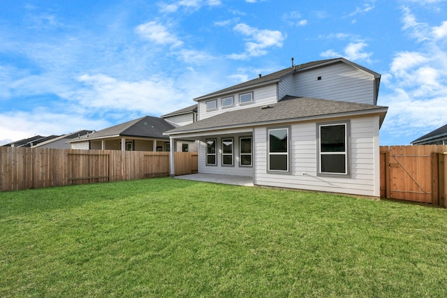 back of property featuring a yard and a patio