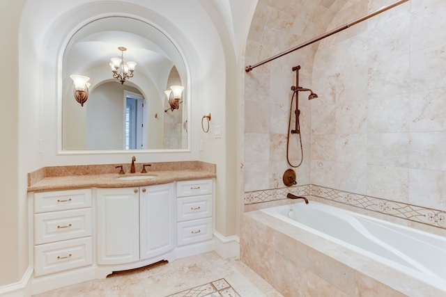 bathroom with vanity, a notable chandelier, tile patterned floors, and shower with separate bathtub