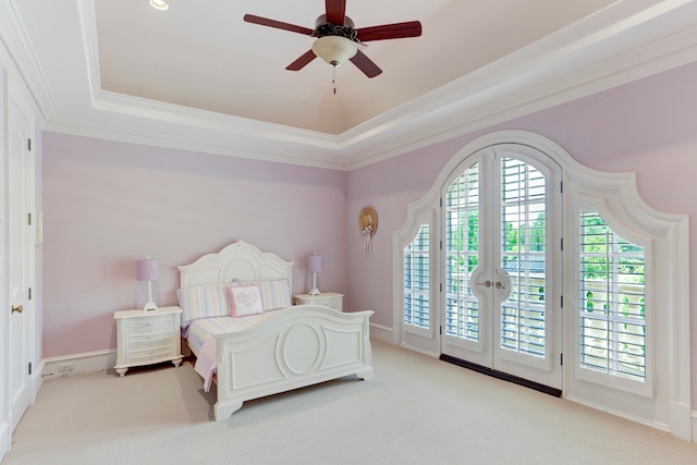 bedroom featuring access to outside, a raised ceiling, ceiling fan, light carpet, and ornamental molding