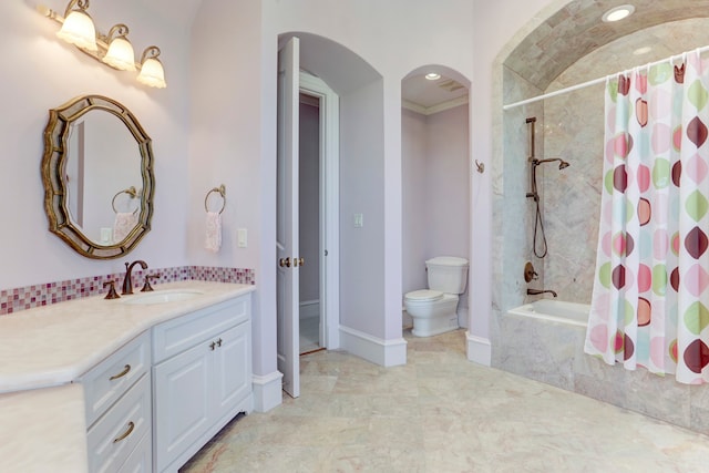 full bathroom featuring toilet, shower / bath combo, and vanity