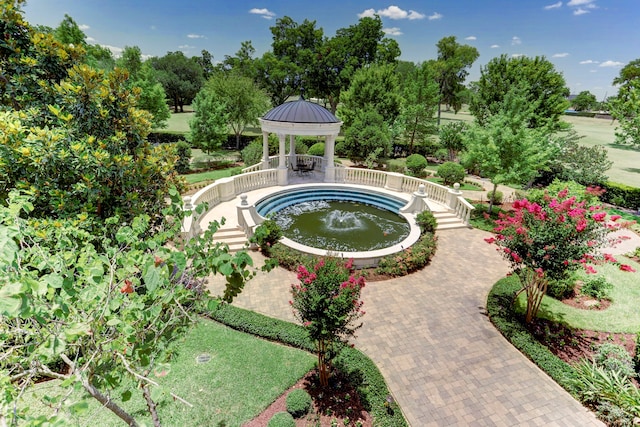 view of swimming pool featuring a gazebo and a jacuzzi