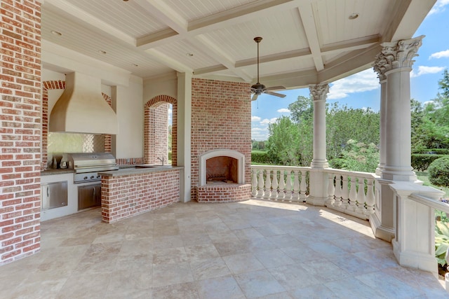 view of patio with an outdoor kitchen, ceiling fan, area for grilling, an outdoor brick fireplace, and sink