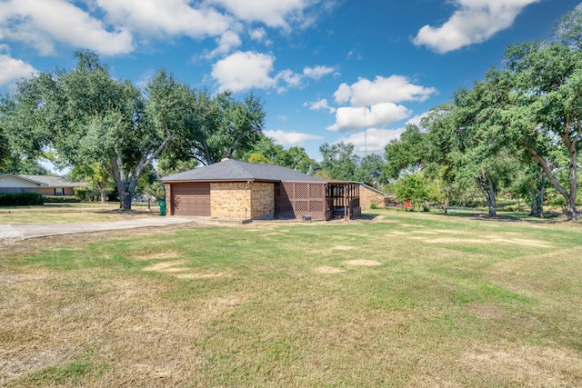 view of yard with a garage