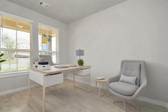 office area with visible vents and baseboards