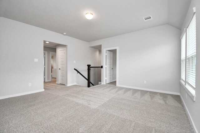 unfurnished room featuring baseboards, visible vents, and carpet floors