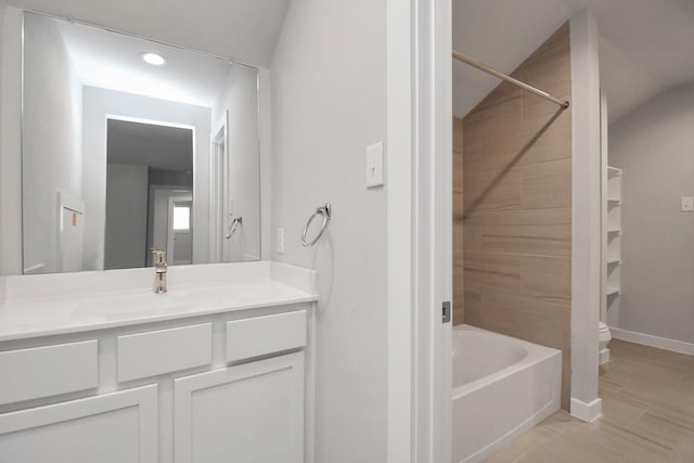 bathroom with toilet, recessed lighting, vanity, and baseboards