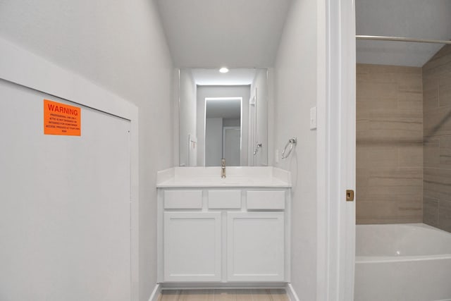 bathroom with vanity and baseboards