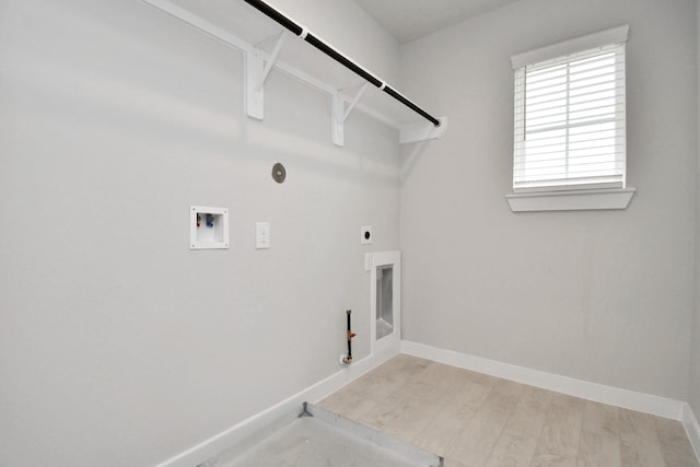 laundry area with hookup for an electric dryer, hookup for a gas dryer, baseboards, hookup for a washing machine, and laundry area