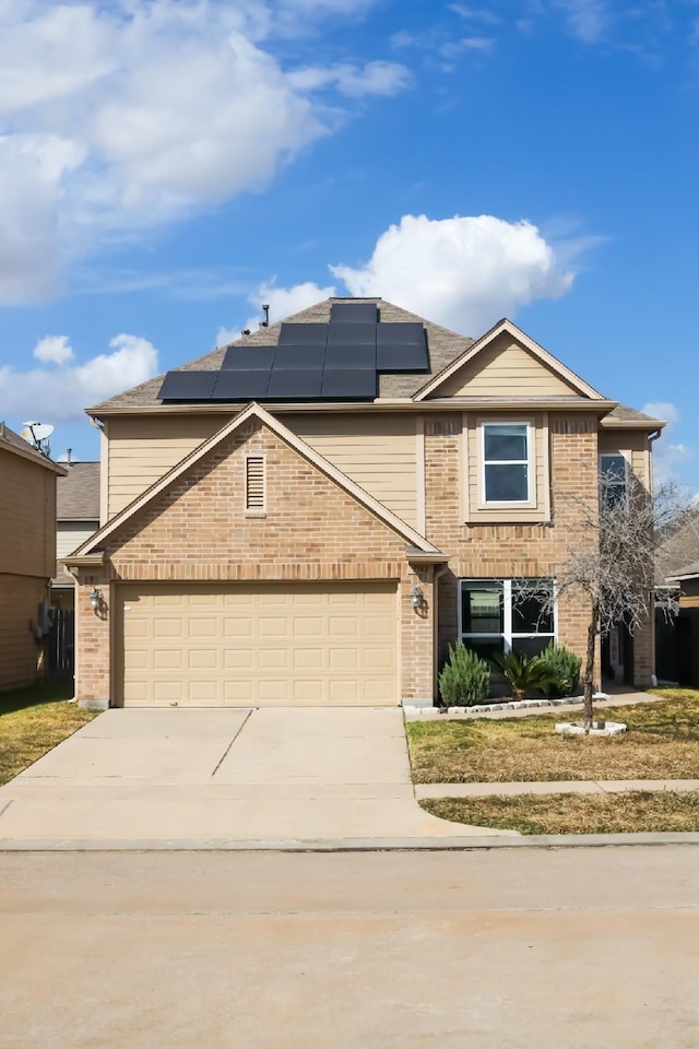 front facade featuring solar panels and a garage