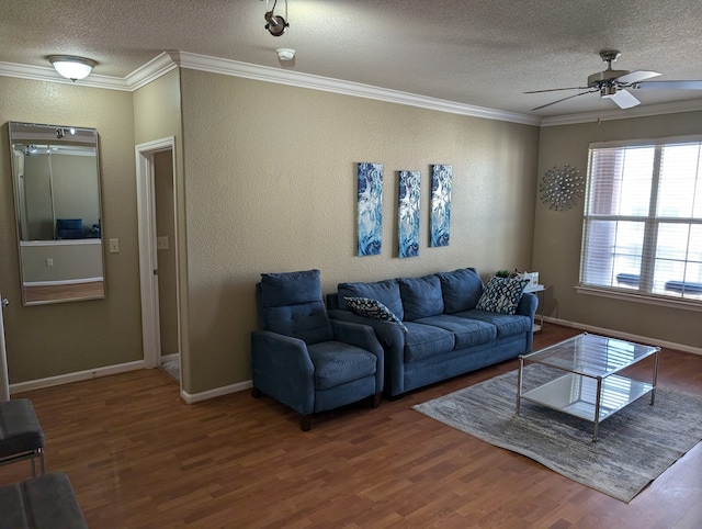 living room with crown molding, a textured ceiling, wood-type flooring, and ceiling fan