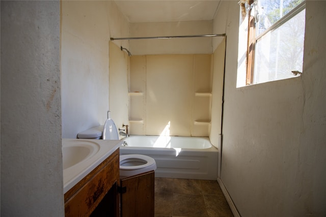 full bathroom featuring vanity, washtub / shower combination, toilet, and tile patterned flooring