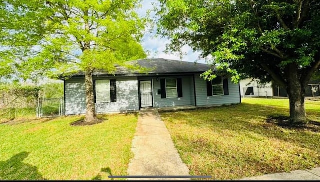 ranch-style home with a front lawn