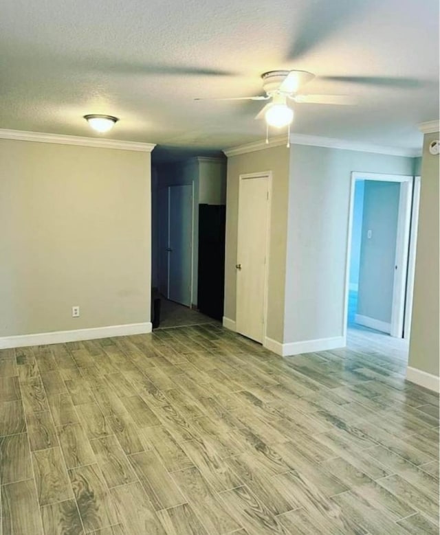 unfurnished room featuring ceiling fan, a textured ceiling, ornamental molding, and light hardwood / wood-style flooring