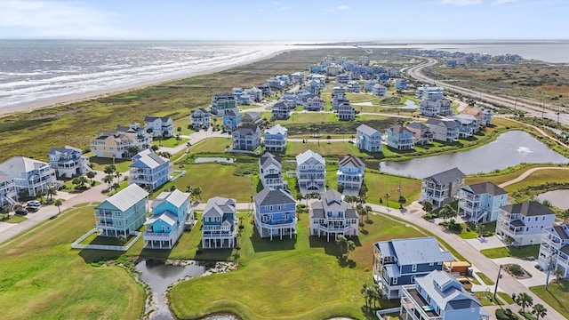 bird's eye view featuring a water view and a view of the beach