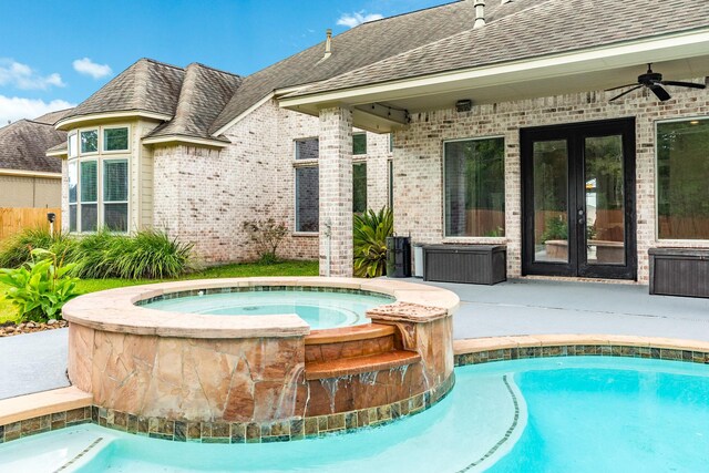 view of pool with an in ground hot tub, ceiling fan, and a patio area