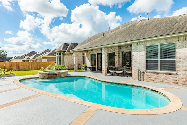 view of swimming pool featuring an in ground hot tub and a patio