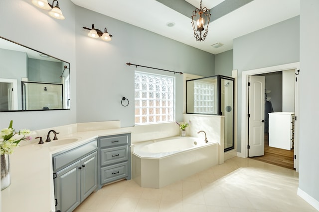 bathroom featuring vanity and shower with separate bathtub