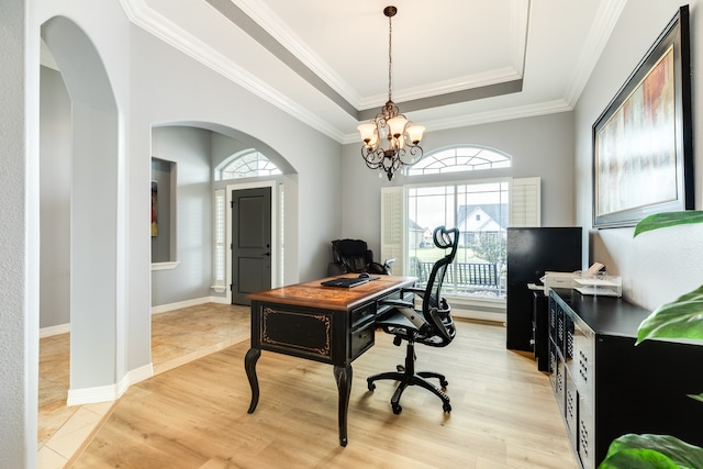 office featuring a wealth of natural light, a chandelier, crown molding, and light wood-type flooring