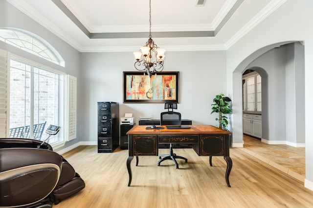 office area with crown molding, a notable chandelier, and light wood-type flooring