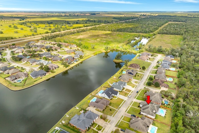 birds eye view of property with a water view