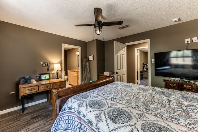 bedroom featuring ceiling fan, a textured ceiling, dark hardwood / wood-style flooring, and ensuite bathroom