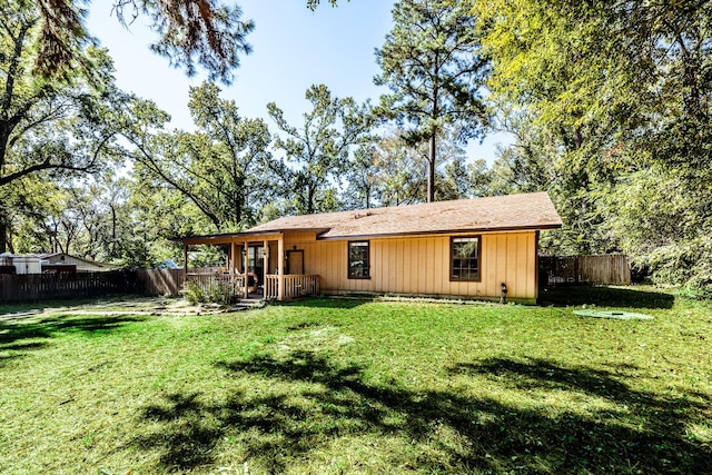 12 Dove St, New Waverly, TX 77358 - back of property featuring a shingled roof