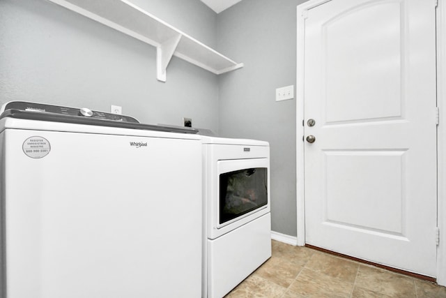 washroom with washer and dryer