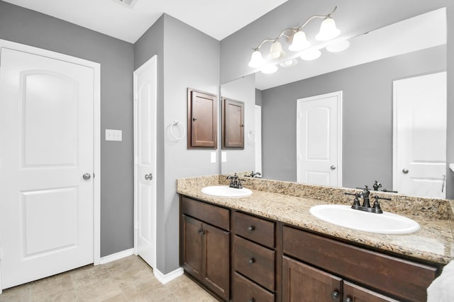 bathroom featuring vanity and tile patterned flooring